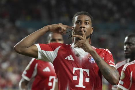 Michael Olise of Bayern Munich celebrates a goal.