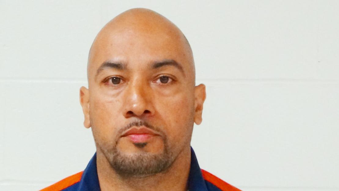 Headshot of a bald man.
