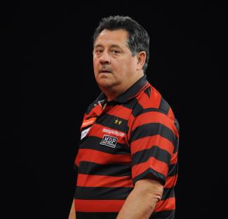 Dennis Priestley during a darts match.