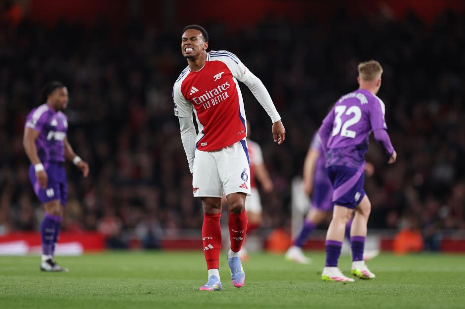 Arsenal's Gabriel Magalhaes clutching his hamstring during a match.