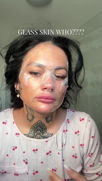 Person with a facial sheet mask.