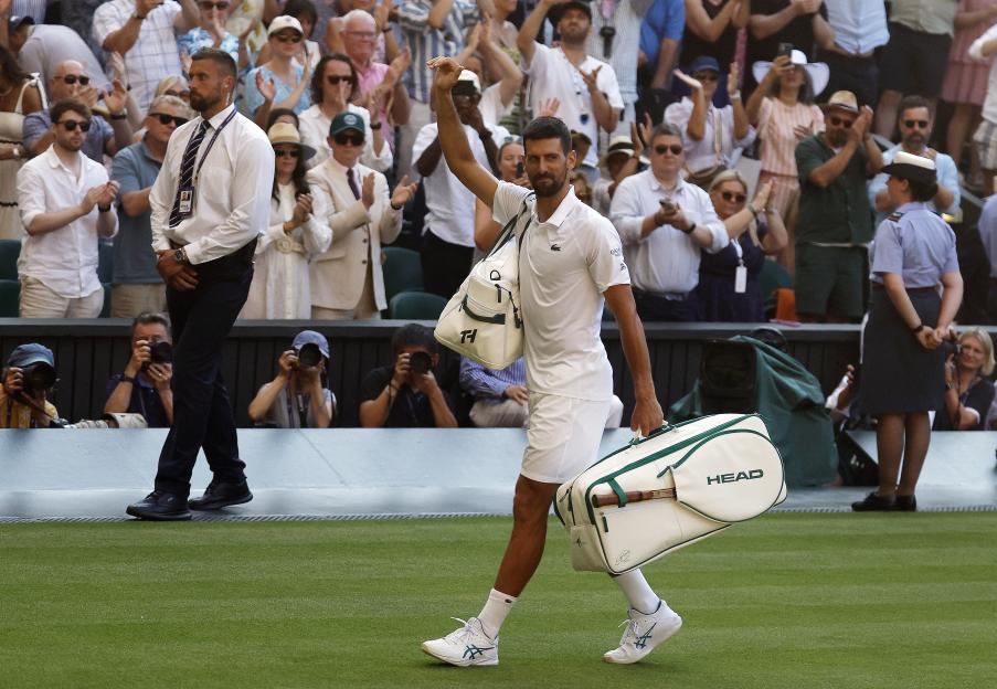 Novak Djokovic leaving the court after a Wimbledon semi-final match.