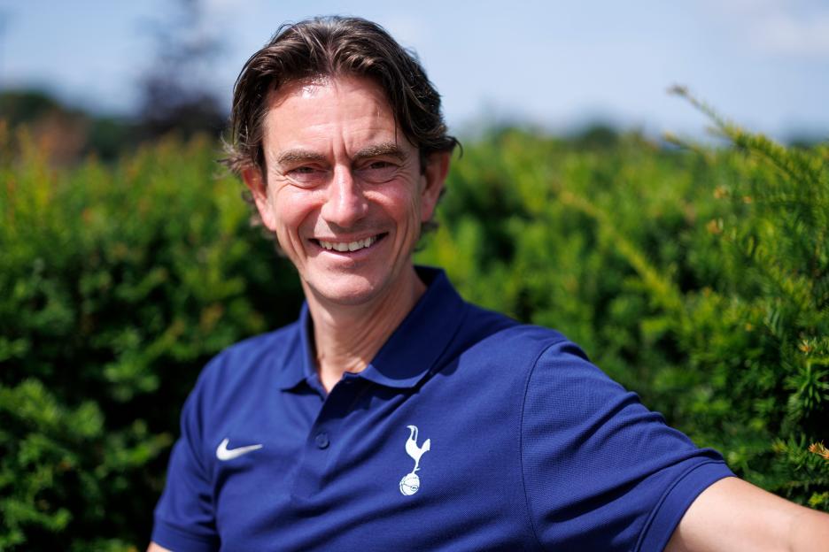 Thomas Frank, Head Coach of Tottenham Hotspur, smiling.