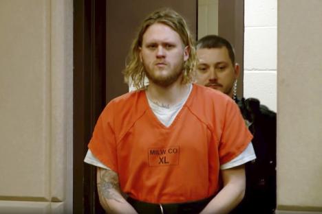 Maxwell Anderson in an orange jail jumpsuit during his initial court appearance.