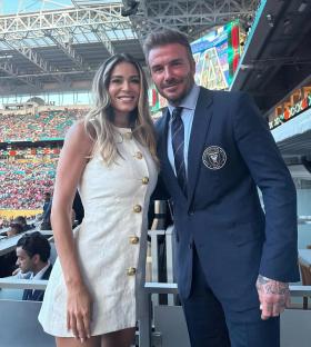 Diletta Leotta and David Beckham at a soccer stadium.