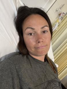 Woman in hospital bed after suffering a cerebrospinal fluid leak.