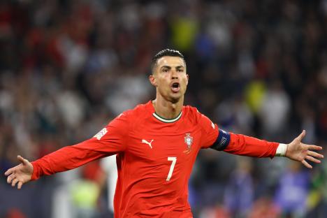 Cristiano Ronaldo and Nuno Mendes of Portugal celebrating a goal.