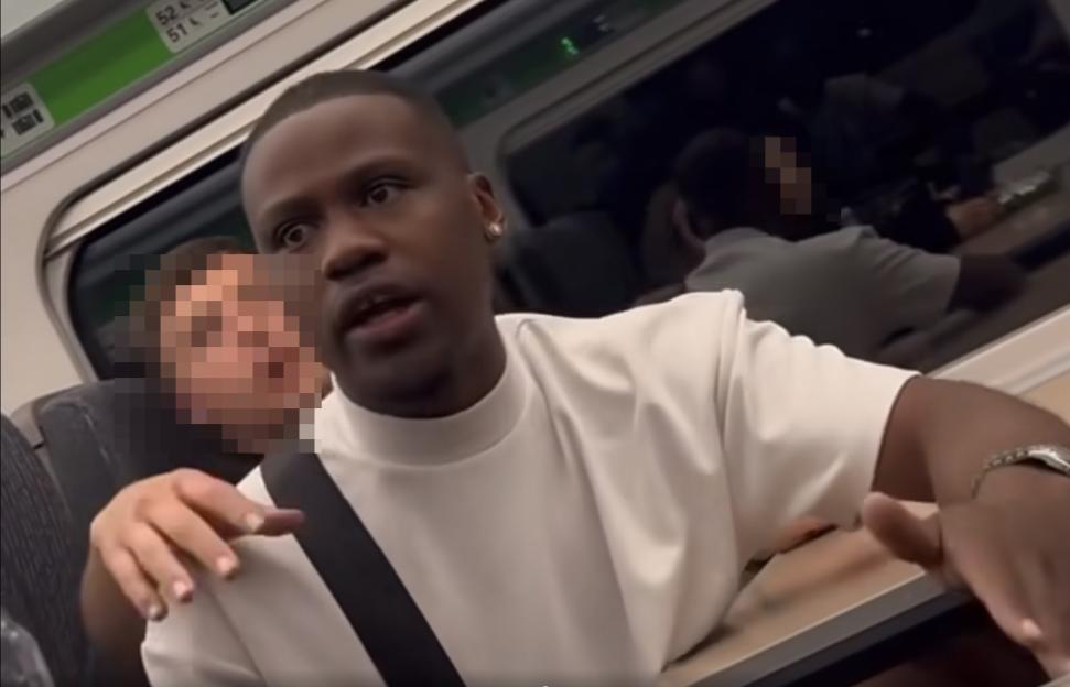 A man on a train making threats.