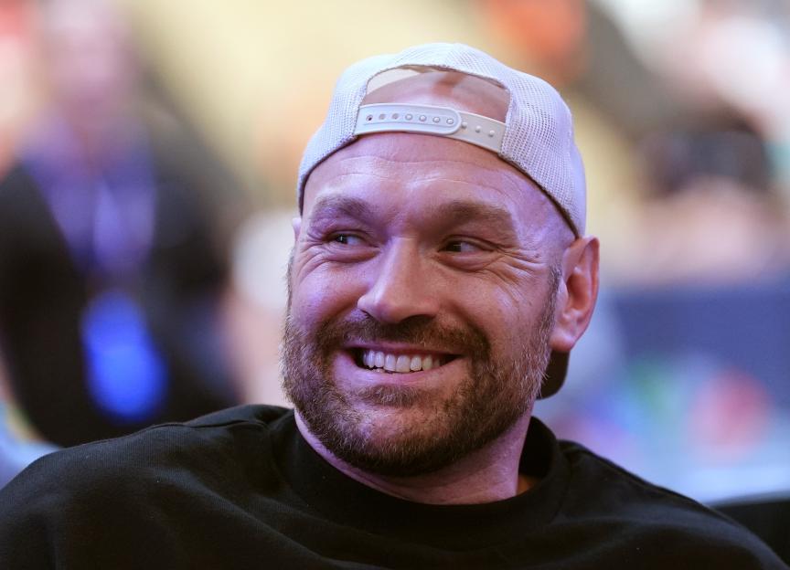 Tyson Fury smiling at Wembley Stadium.