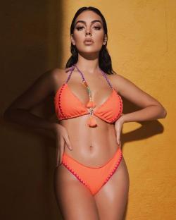 Georgina Rodriguez modeling an orange bikini.