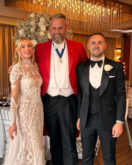 Chloe Kelly on her wedding day with her husband Scott Moore and her Toastmaster