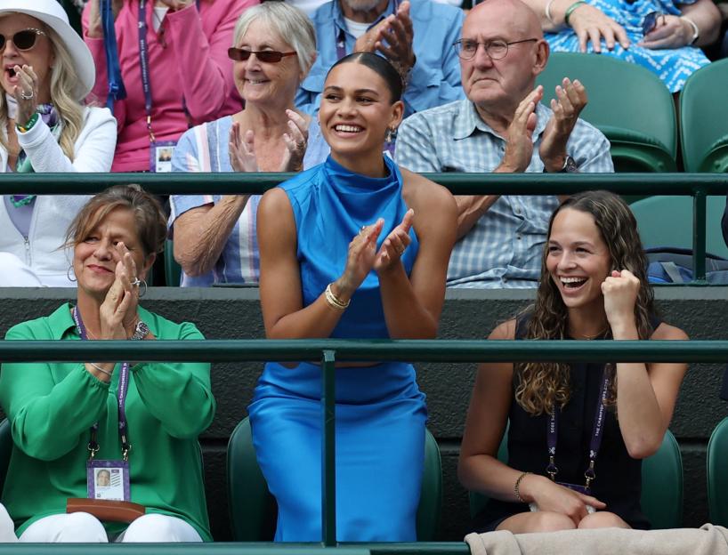 Trinity Rodman, girlfriend of Ben Shelton, cheering in the stands at Wimbledon.