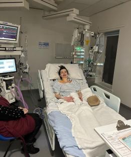 Woman in hospital bed.
