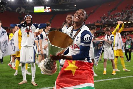 Mathys Tel of Tottenham Hotspur holding the UEFA Europa League trophy after their victory.