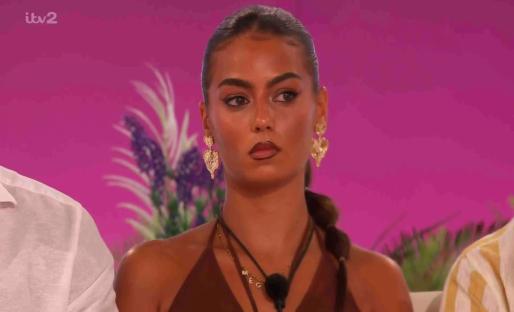 Shakira from Love Island at the fire pit.