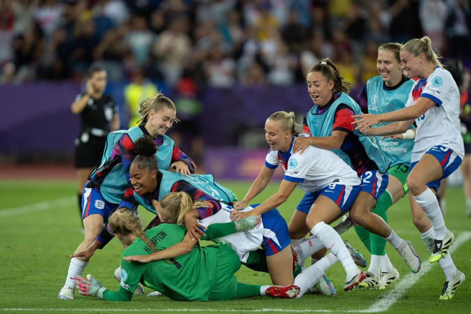 English soccer players celebrating a goal.