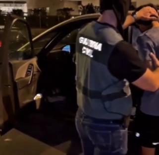 Arrest of a masked man by police.