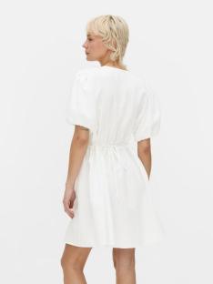 White dress with puff sleeves and cinched waist, viewed from behind.