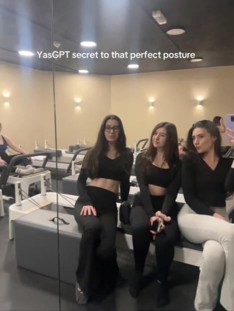 Three women in a Pilates studio.
