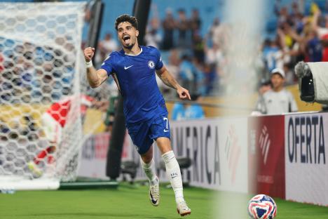 Pedro Neto of Chelsea FC celebrating a goal.