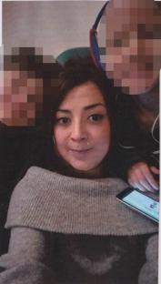 Photo of Andrea Gharsallah with her children's faces pixellated.