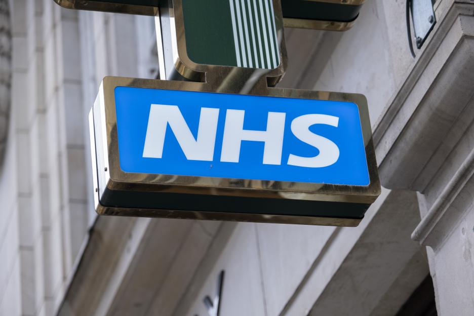 NHS sign outside a pharmacy.