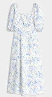 White midi dress with blue floral print and puff sleeves.