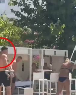 Men and women at a resort poolside.
