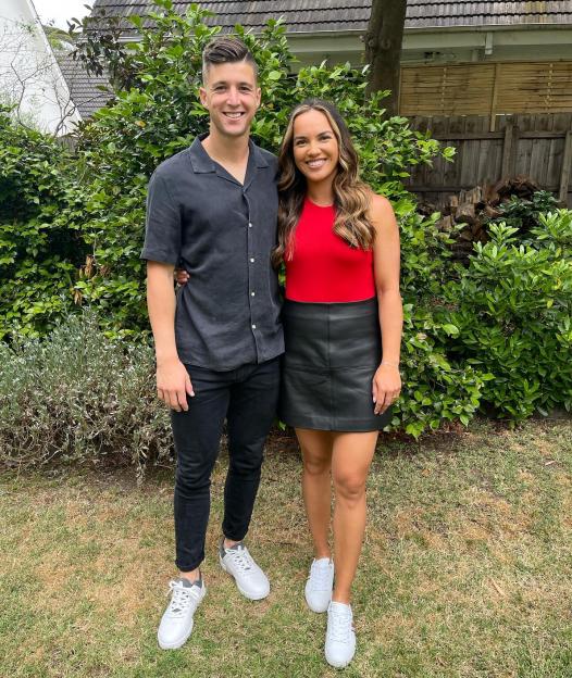 Desirae Krawczyk and Andrew Harris posing together.