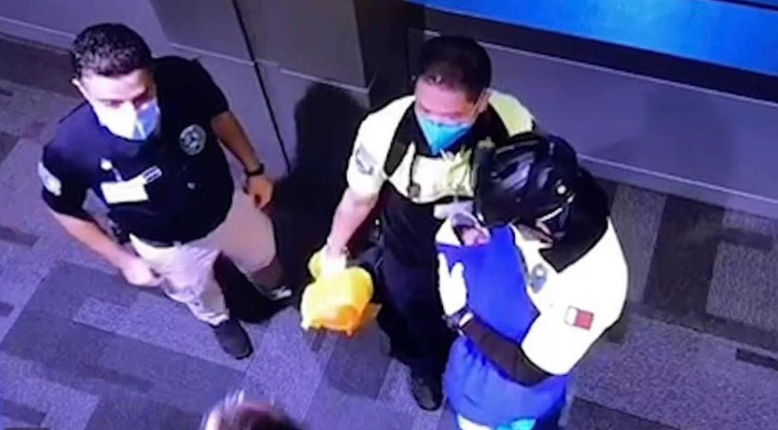 CCTV footage of authorities in Qatar holding a baby found in a toilet bin at Hamad Airport.