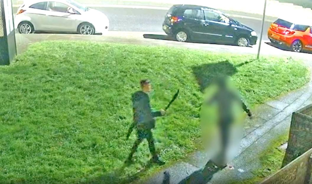 Security camera footage of a machete attack.