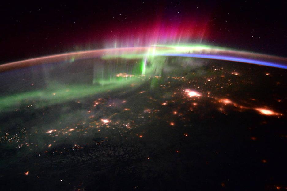 Aurora borealis over Earth at night.