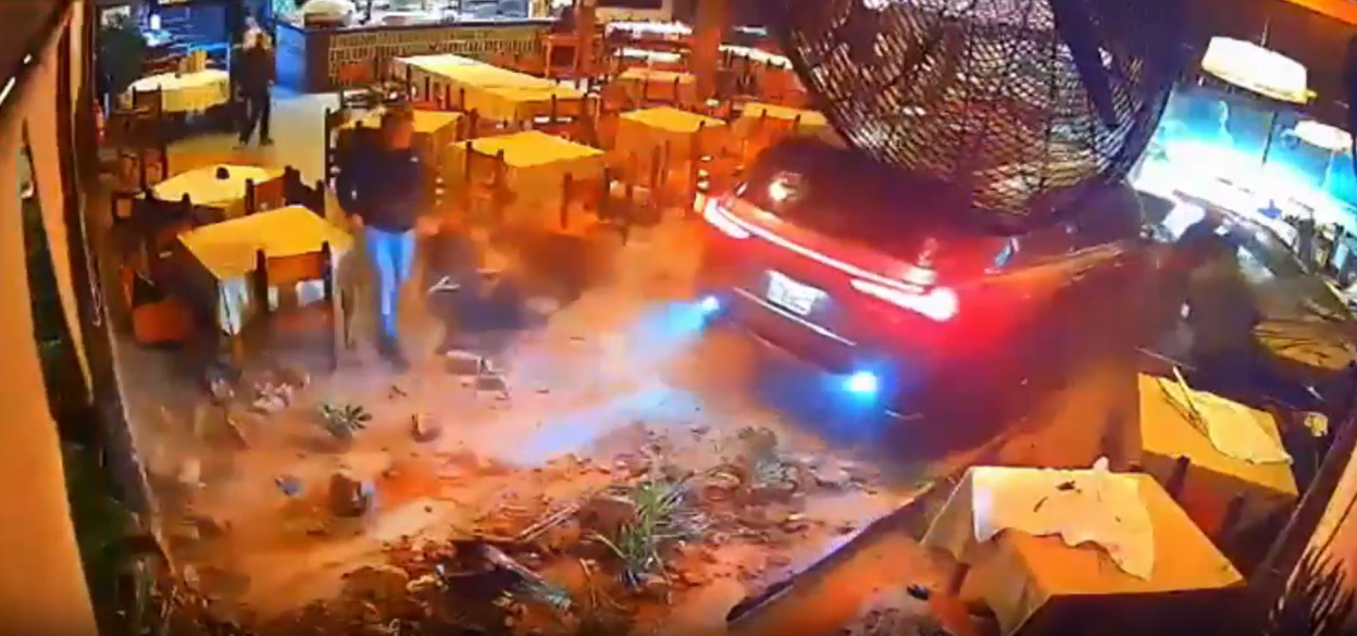 Car crashes into restaurant.
