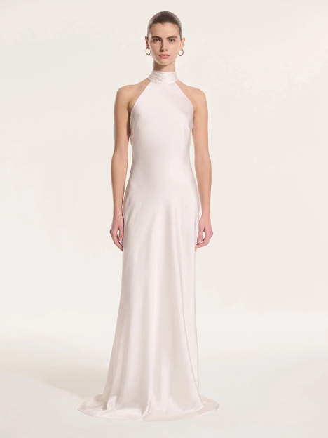 Woman in a white halter neck gown.