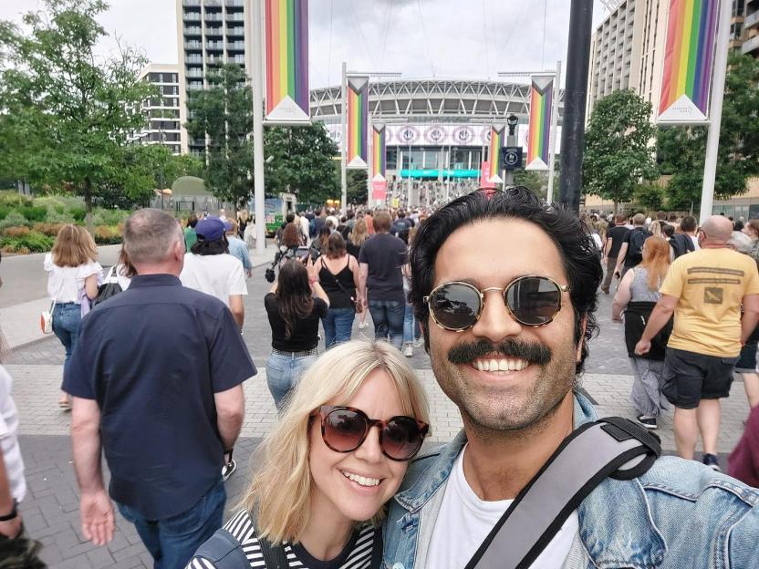 Georgia Taylor and Charlie De Melo at an outdoor event.