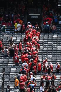 Stadium evacuation during a soccer match due to bad weather.