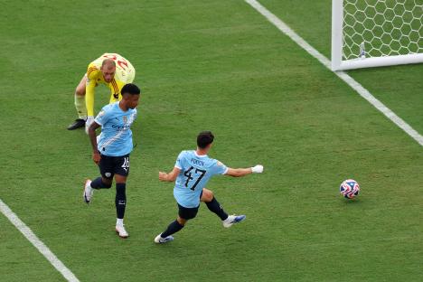 Phil Foden #47 of Manchester City scores a goal.