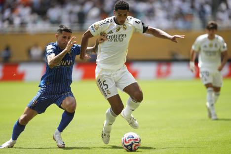 Jude Bellingham of Real Madrid vying for the ball during a soccer match.
