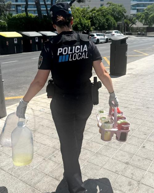 Police officer confiscating unsanitary cocktails.