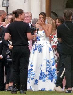 TV presenter Nick Knowles' wedding; bride in blue and white floral dress.