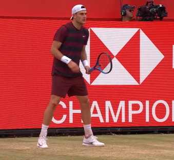 Tennis player holding a racket.