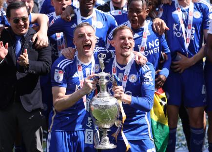 Leicester City players celebrating with the Championship trophy.