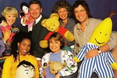 Photo of the Play School presenters with puppets and toys.