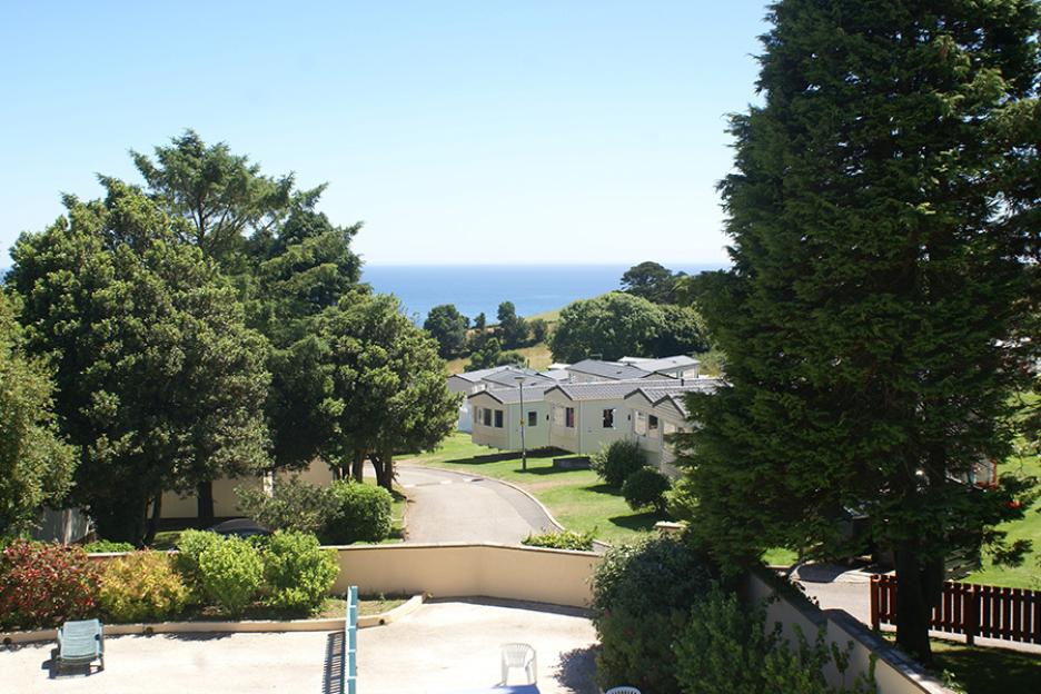 Overlooking Polperro Holiday Park with ocean view.