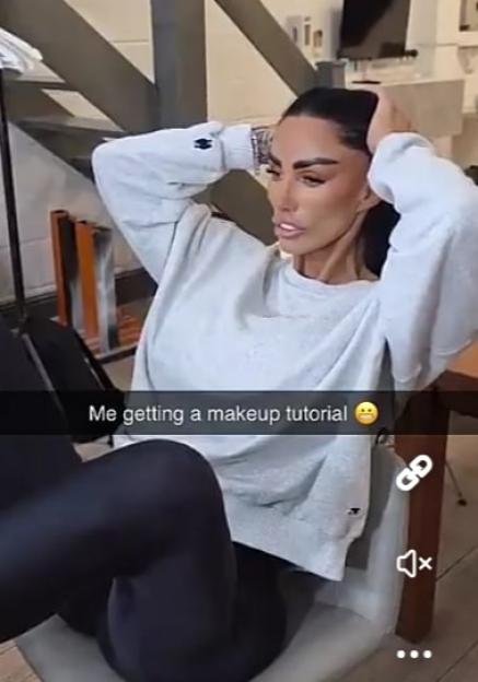 Katie Price receiving a makeup tutorial.
