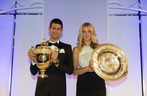 Novak Djokovic and Petra Kvitova holding their Wimbledon trophies.