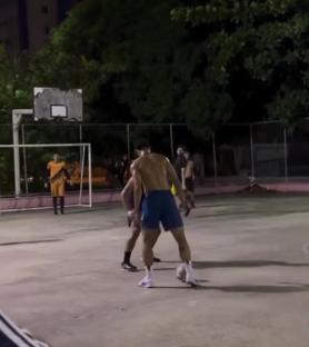 Matheus Cunha playing soccer at night.