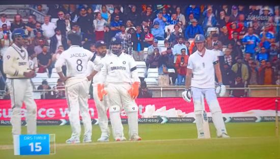 Cricket players on the field during a match.
