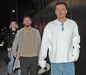 Jack Grealish leaving a London venue with companions.