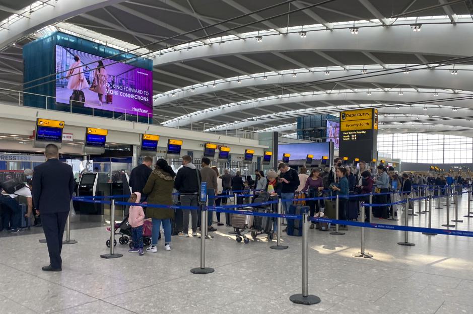 File photo dated 23/4/2022 of passengers queue to check-in bags in departures at Terminal 5 of Heathrow Airport, west London. The majority of UK households are feeling financially secure, with 70% of people confident enough to plan a summer holiday, according to a survey. The number of people feeling financially secure has risen this quarter by three percentage points to 58%, while confidence that the UK economy is improving has risen to 17% from one in 10 three months ago, the KPMG Consumer Pulse poll found. Issue date: Monday July 7, 2025. PA Photo. Photo credit should read: Steve Parsons/PA Wire